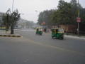 Zooming auto-rickshaws in New Delhi