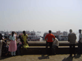 Behind the Gateway, the maritime traffic still teems.
