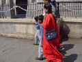 A striking red outfit against the Imperial stone.