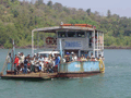 The vehicle and passenger ferry over the River Tiracol, in the far north of the state. The banner above the passengers advertises a state polio immunisation programme.