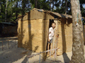 Our pad in Palolem: Jamesy on the doorstep of our coco-hut.