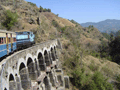 Leaning out of the window, the wind in my hair, with one of the many viaducts the British built when they hacked out the line about 100 years ago.