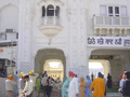 The entrance. The guy in orange stands in front of the footbaths to keep an eye on things, help people out and make sure the rules (bare, washed feet, and covered head) are followed.